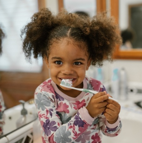 Child brushing teeth