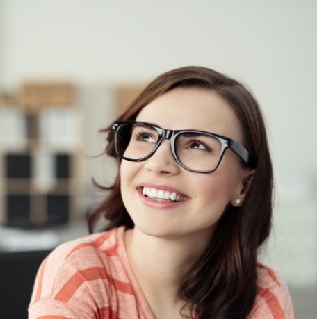 Woman sharing beautiful smile after clear correct treatment