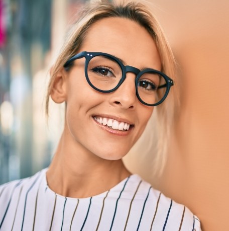 Woman sharing flawless smile after cosmetic dentistry