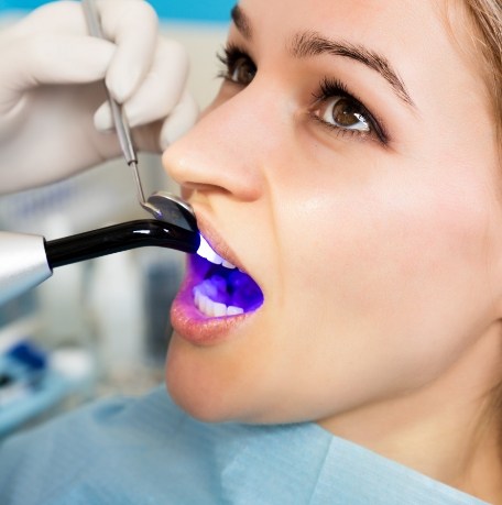 Dentistry patient receiving dental bonding