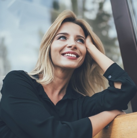 Woman with flawless smile after cosmetic dentistry