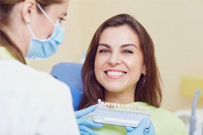 Woman in the dental chair grinning