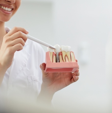 dEntist explaining the cost of dental implants