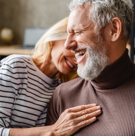 Man and woman laughing together