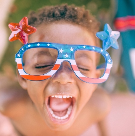 Child laughing outdoors