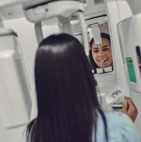 Woman receiving 3 D C T cone beam digital x ray scans