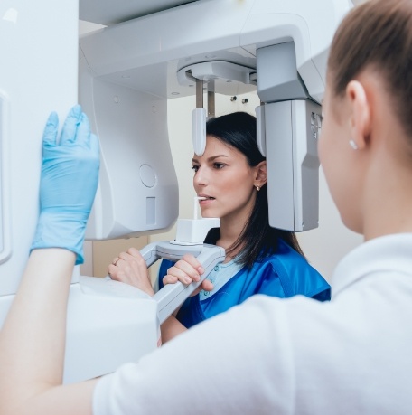 Dental patient receiving C T cone beam x ray scans