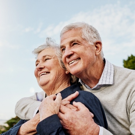 Man and woman enjoying the benefit of dentures