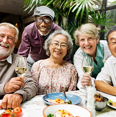Dentures patient in Soldotna talking with friends