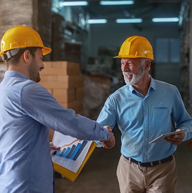 Dentures patient in Soldotna shaking hands with an employer