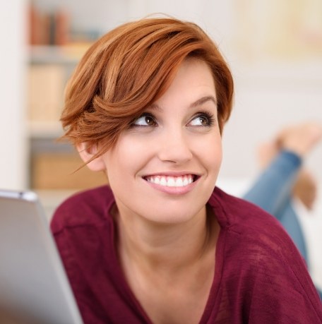 Woman smiling after gum disease treatment