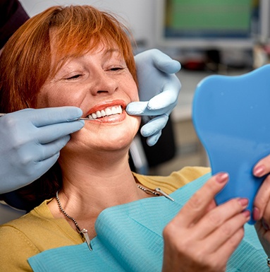 woman smiling while having dental checkup 