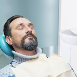 Man relaxing after visiting the sedation dentist