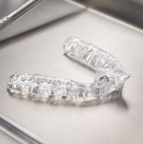 Clear nightguard for bruxism on metal tray