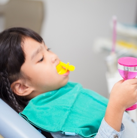 Child receiving fluoride treatment