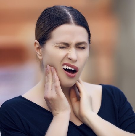 Woman in pain before root canal treatment