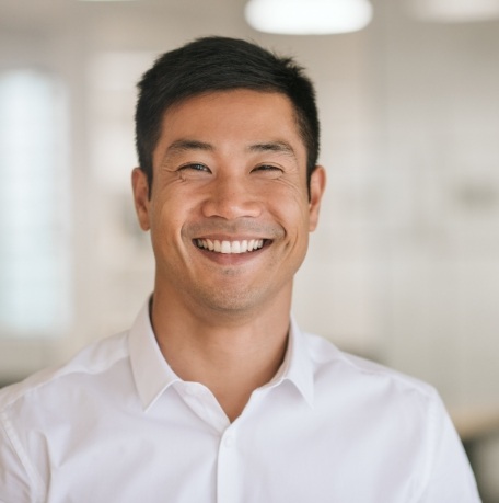 Man smiling after root canal treatment