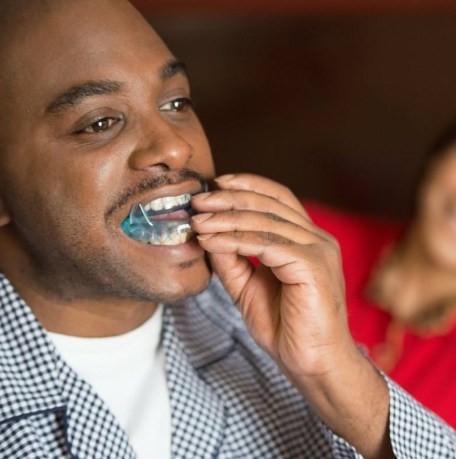 Man placing an oral appliance