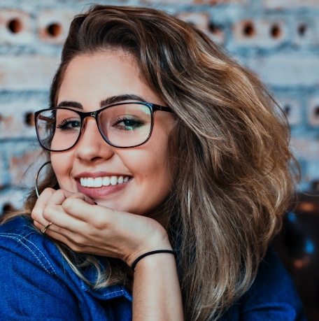 Woman showing off her flawless new smile