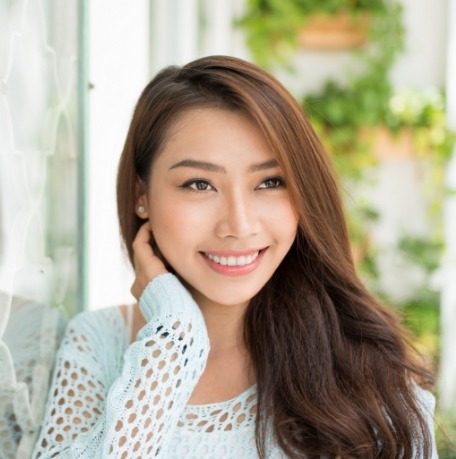 Woman sharing bright smile after teeth whitening