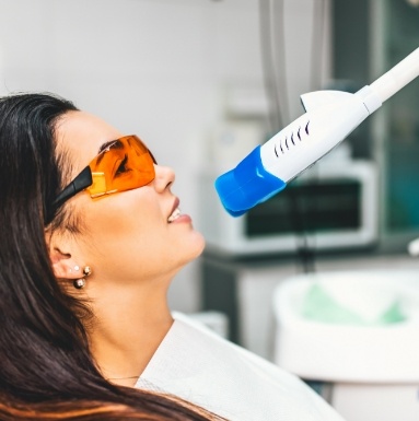 Woman receiving in office teeth whitening