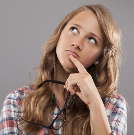 Woman considering professional teeth whitening options