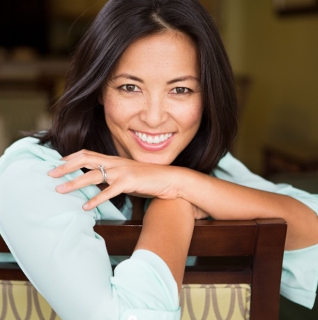 Smiling woman enjoying the benefits of tooth colored fillings