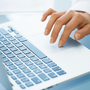 Person using computer to view dental insurance forms