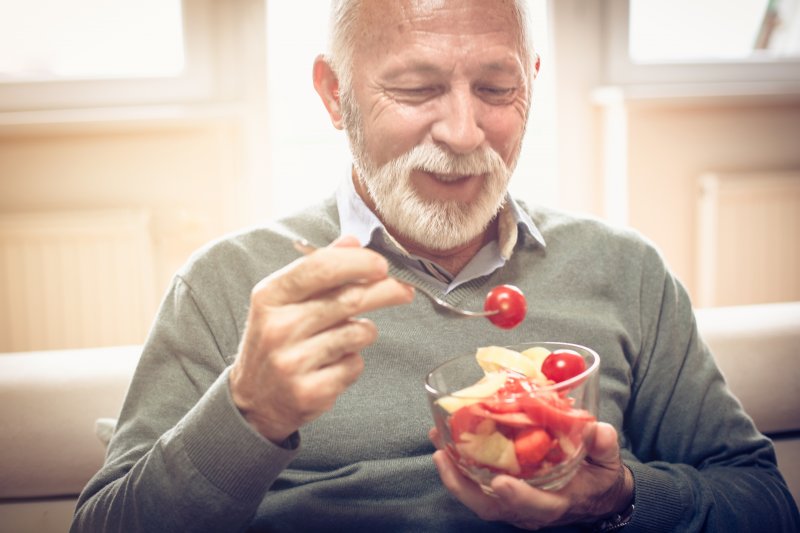 Patient with dentures eating