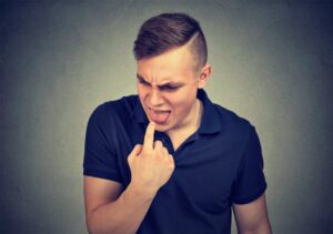 Man gagging on bad taste in his mouth. 